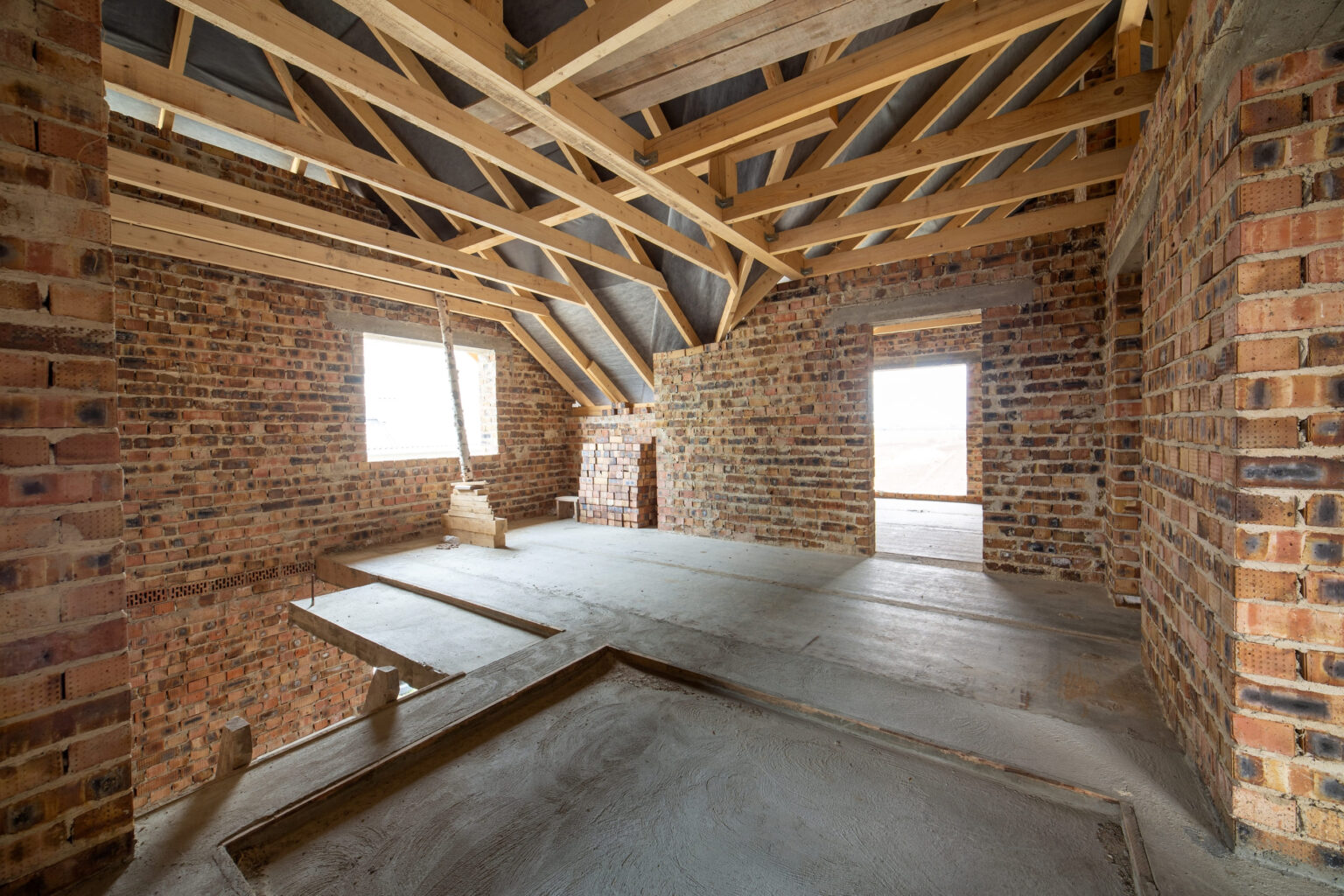 interior-of-unfinished-brick-house-with-concrete-f-2024-12-07-01-10-40-utc