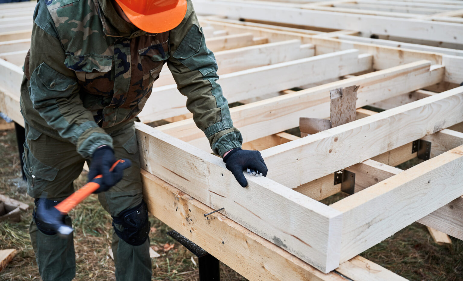 man-worker-hammering-while-building-wooden-frame-h-2025-01-16-23-08-06-utc